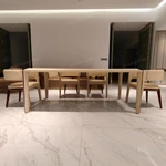 Upholstered-Leg Dining Table with Amber Burl Wood Top and Metal Accents
